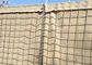 Στρατιωτικός Hesco διατηρώντας τοίχος εμποδίων προμαχώνων γεμισμένος άμμος για την προστασία